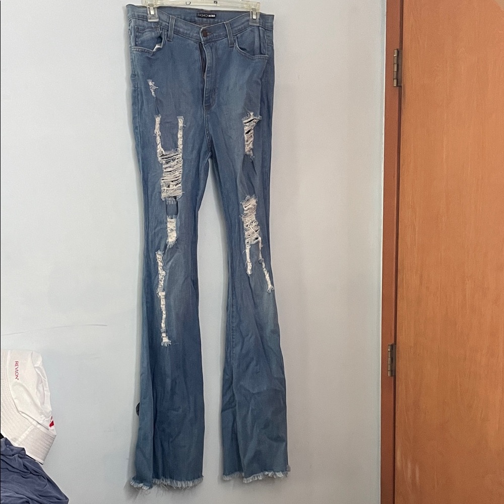 Fashion Nova Distressed Flare Jeans in Blue